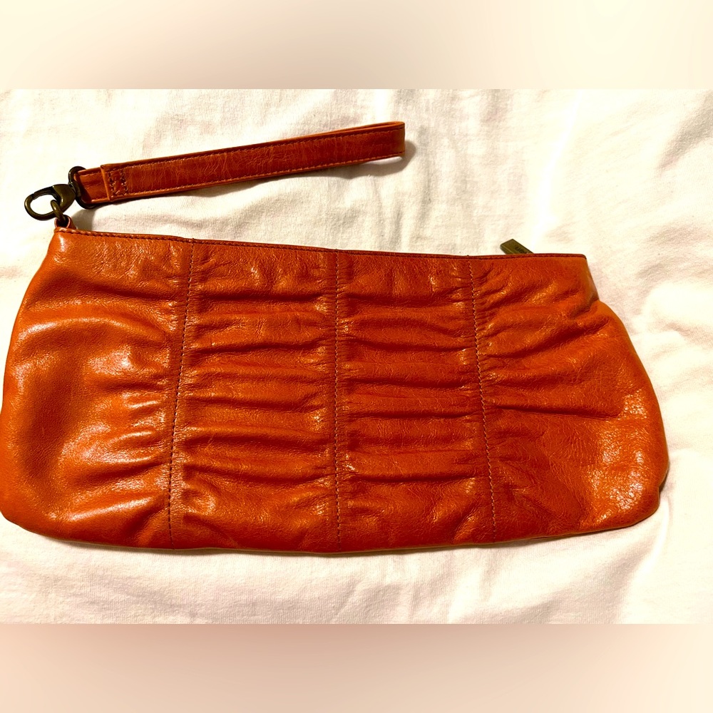 HOBO International orange wristlet clutch